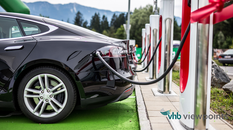 An electric vehicle plugged into a charging station.