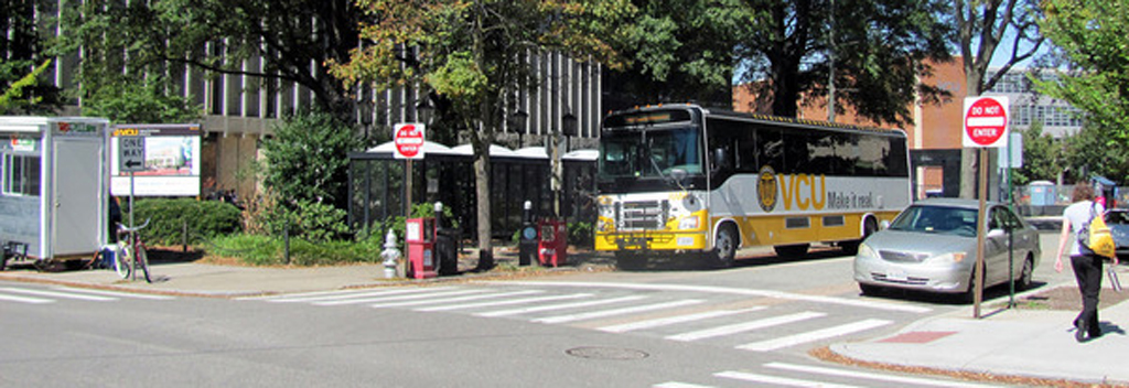 A parked bus at an intersection